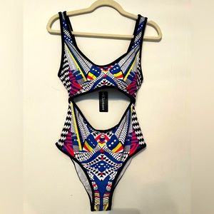 Brand new one piece bathing suit. Vibrant pattern! Size large!
